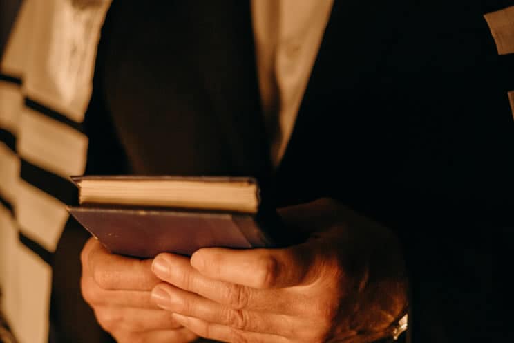 Cantor holding Torah