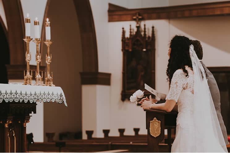 couple at the altar in catholic church
