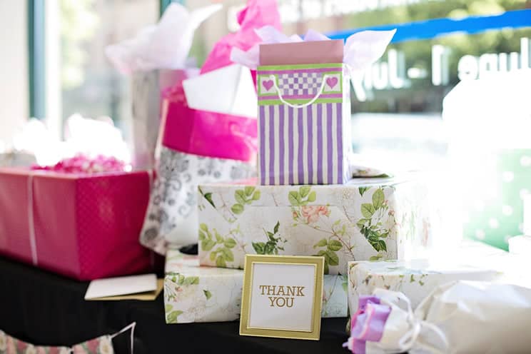 Wedding presents on table with thank you card