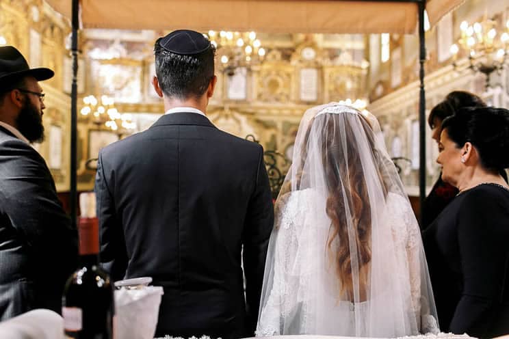 Jewish couple getting married in Synagogue