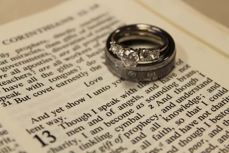 Wedding ring placed on bible page
